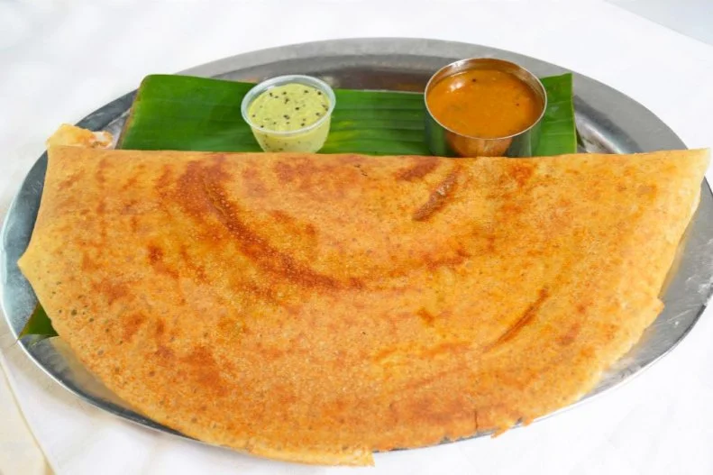 Nestled among the mithai shops and sari boutiques in Little India, Shri Balaji Bhavan is a favorite for vegetarian street eats, with a menu boasting papdi chat, dosa and milk-based drinks like mango lassi. Chaat dishes, served traditionally topped with raw onions, tomatoes, tamarind chutney and creamy yogurt, are all under $4, while larger dishes like the spiced potato-stuffed dosa served with peppery sambar are under $7. If any of the dishes prove to be too spicy for your blood, an order of syrupy-sweet gulab jamun (milky balls of deep-fried dough) is available to save the day for only $2.69.