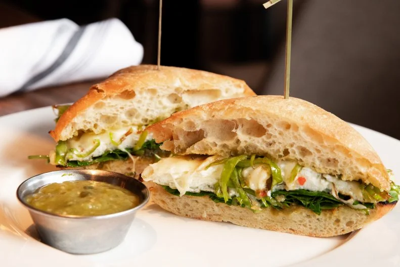 This sandwich may be super-healthy, but that doesn't keep it from packing a punch. It's built on ciabatta, and the egg white is topped with pepper Jack cheese. Shishito and jalapeno peppers, kale and spinach are layered on top, and the sandwich is served with a side of salsa verde.