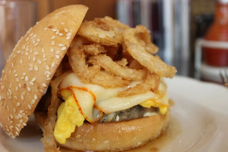 This isn't your typical cemita, since there really isn't typical anything at any of Paul Kahan's restaurants. Be prepared to get sticky with this breakfast sandwich that's the perfect balance of savory and sweet. For the filling, soft-scrambled eggs and green chile chicken sausage are topped with melted Muenster cheese, piled high with fried onions and slathered with smoked-pepper aioli. A touch of salt is added before the traditional-style Mexican sesame seed bun gets a dip in maple syrup.