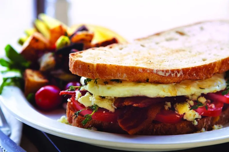 One of the most-coveted breakfast sandwiches in Chicago can be found at this Andersonville cafe that's been making people happy and filling their bellies since 2003. The sandwich starts with sourdough boule that's toasted, layered with two over-medium eggs and applewood bacon, and topped with juicy sliced plum tomatoes, pungent Gorgonzola and fresh thyme. It's best enjoyed as a leisurely breakfast with house potatoes and a cup of coffee.