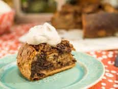 Jeff Mauro uses day-old cinnamon-raisin bread as the base for his simple bread pudding recipe. Top it all off with a cinnamon-spiced whipped cream for a decadent dessert.