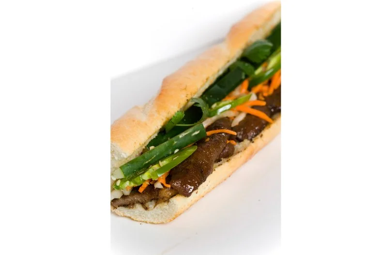 A short walk from the Talin Market, Albuquerque's destination for international groceries, is the Vietnamese bakery-deli Coda Bakery. The beloved pork banh mi — a footlong sandwich for $6.50 — is composed of marinated, grilled pork on a fresh baguette, made complete with crisp vegetables and a Vietnamese mayo spread.