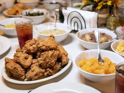 Lunch in Mrs. Wilkes Dining Room is like a typical family meal in households across the South. Community tables of 10 are filled with family, friends and strangers, and close to two dozen shareable platters and bowls filled with rotating Southern staples like fried chicken (sinful and, thankfully, available every day), beef stew, meat loaf, cornbread dressing, candied yams, black-eyed peas, okra and tomatoes, butter beans, mashed potatoes, pickled beets, collard greens — you get the idea. To make it feel even more like home, it's first-come-first-served. Lunch is served from 11 a.m. to 2 p.m. sharp, you clear your own dishes and they only take cash.