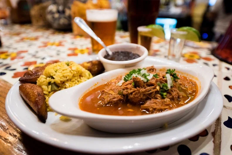 Savannah's restaurant scene includes plenty of typical ethnic genres, but for a truly colorful cultural take, taste a slice of Havana (and more) at Rancho Alegre Cuban Restaurant, where the focus is on Cuban, Caribbean and Spanish dishes. Start with a cool Cuba libre or mojito with appetizers like chicharittas (plantain chips) with mojo sauce, papa rellena (potato ball stuffed with ground beef) or croquetas de jamon (ham croquettes). Then go big with lechon asado (roasted and shredded pork), slow-cooked stovetop paella Valenciana or the national dish of Cuba, ropa vieja (slow roasted shredded beef in a Creole sauce), all served with yellow rice, black beans and sweet fried plantains. There's live Latin jazz on the weekends.