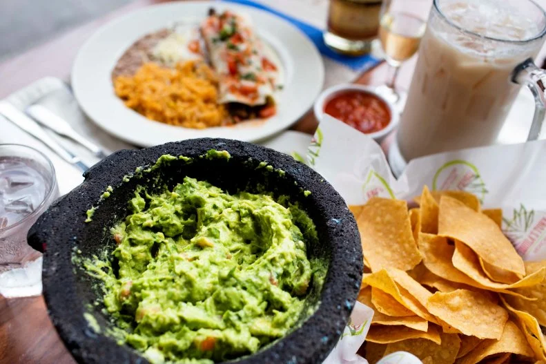 Sure, there are some great taco shops in Savannah. But this is where you want to go for an authentic Mexican experience. Owned and operated by a group of Mexican "compadres," the legit menu is filled with genuine Mexican recipes and Tex-Mex favorites like the Piggy Burritos filled with shredded pork carnitas and topped with queso dip and pico de gallo. Start with the tableside made-to-order guacamole â   you get to pick your ingredients and your heat level â   served up in a lava-rock molcajete. The street tacos won't disappoint, and you can mix and match from 10 tasty selections. Wash it all down with the restaurant's own house-branded tequila, Tequila Blanco, in a margarita or tequila cocktail.