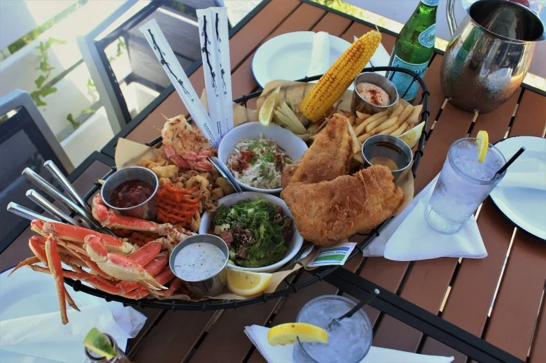Oceanfront dining is less than 20 miles away on Savannah's Tybee Island, and The Deck — nestled within the dunes — offers up killer views and a classic beachfront vibe. It's all about the seafood here, whether you're dining inside (plenty of windows bring in the ocean breeze) or out on the deck. Start with the crab cakes, served up with charred-pineapple chutney and arugula. Fave entrees include Buffalo shrimp tacos with cilantro slaw and blue cheese crema, and the massive seafood platter, which serves two to three people. It includes beer-battered tempura cod, grilled shrimp, fried calamari, snow crab legs, ahi tuna poke, corn on the cob, malt vinegar fries, sweet potato fries and island slaw, so you'd better come hungry.