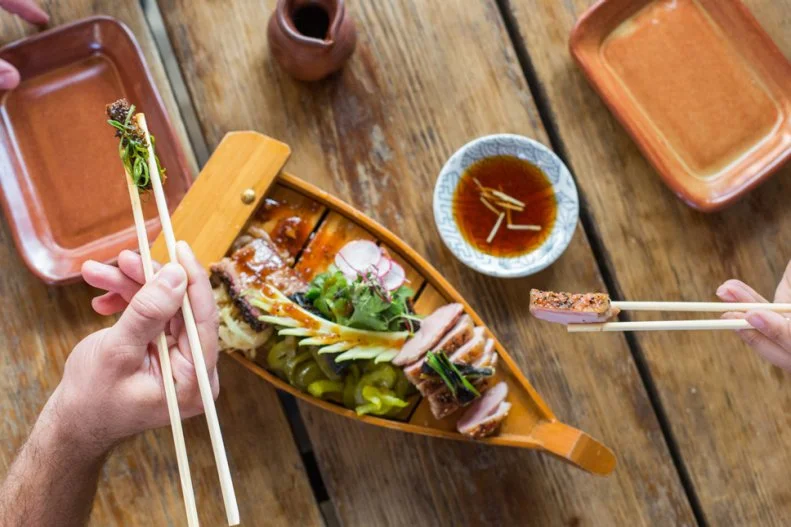 From the chef who brought the ramen craze to Austin, Kemuri Tatsu-ya blends the concept of a Japanese izakaya with that of a Texas barbecue joint. Of course the menu features ramen (with beef broth and brisket), but there's so much more than just noodles. You'll want to order plenty from the Smoked section of the menu, which features a buttery fish collar, BBQ eel, and spicy pork ribs rubbed with gochujang pepper. The mix of Texas technique and Japanese flavors makes this the most-exciting part of the menu, but it's also a good idea to order some skewers (beef tongue, chicken hearts) and the classic chicken karaage. And if chicken heart isn't wild enough for you, dare to order off the Exotic menu — we recommend trying the squid guts (once).