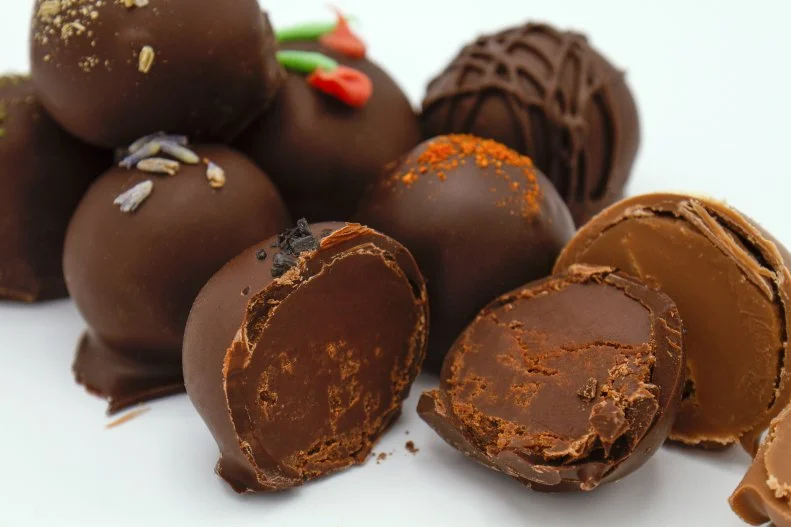This multifaceted chocolate concept that includes not only a chocolate shop but also a bar and restaurant started with a box of chocolates. Owner Phil Simonsonâ  s husband made him chocolates from his own personal recipe, and the rest is history. To this day they still use that as their base chocolate recipe, filling their 300 flavors of truffles with ingredients like Spam and pineapple, drunken goat cheese and Vidalia onions, and salted caramel apple. The restaurant menu pulls in chocolate whenever possible â   the pulled pork uses a chocolate bourbon BBQ sauce, and the green salad even has chopped chocolate in it!