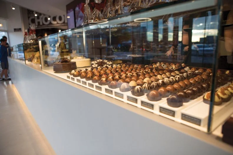 From the age of 8 Cathy Brand was whipping up chocolate creations at home, and decades later she has a small chocolate empire in Indiana, with four shops in Fort Wayne and another in Indianapolis. DeBrand's chocolatiers focus on classic chocolates like caramel and mocha, and also have fun with exotic flavor combinations like raspberry balsamic and rosemary citrus.