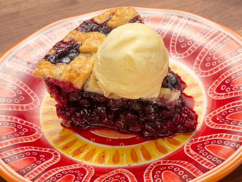 Host Anne Burrell's fruit pie with ice cream dish, as seen on Worst Cooks In America, Season 15.
