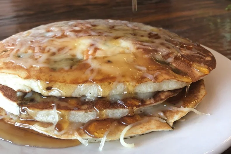 Chocolate chip pancakes are on the menu at the morning-and-afternoon-only Bramble, as are bacon-bourbon ones, but those with savory inclinations will gravitate to the tangy white cheddar cakes, whose flavor pops with a generous dousing of jalapeno-maple syrup. Wash down the pancakes, and the must-try mojo pork breakfast poutine to follow, with a cucumber-infused gin Bloody Mary.