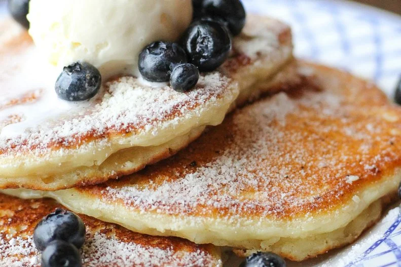 Lemon-ricotta pancakes can be delicious, but they're undeniably common, appearing on countless brunch menus. But the ones at Chef Clay Conley's Grato — a laid-back Italian restaurant serving dishes like pistachio-studded pizza and meatballs with Parmesan polenta — are elevated by blueberries and a generous scoop of cream cheese gelato that decidedly push them into dessert territory. Make the pancakes the finale to crispy rock shrimp with cherry "bomb" butter.
