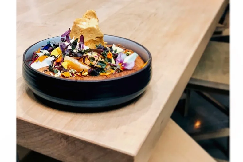 The first stateside location of this Melbourne, Australia, import is known for its coffee made in tandem with small, ethical producers. Breakfast, particularly the gorgeous Golden Child Ricotta Hotcake, is the ideal accompaniment while you savor a cup. Underneath an artful mess of edible flowers is a light, airy pancake decked out with charred peach, pineapple-black sesame crisp, creme fraiche, maple and peach syrups, and cobbler crumbs.