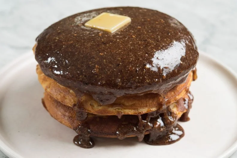 Brooklyn's Williamsburg neighborhood is buzzy and fashionable, but it's also home to laid-back lairs like Sunday in Brooklyn, where locals plunk pretzels into beer cheese and find happiness in soft-serve s'mores. When it's time for brunch, sambal-laced mezcal Bloody Marys pave the way for nutty malted pancakes shellacked in hazelnut-maple-praline syrup and capped with a pat of brown butter. Share a plate of them as a prelude to the cheddar scramble.
