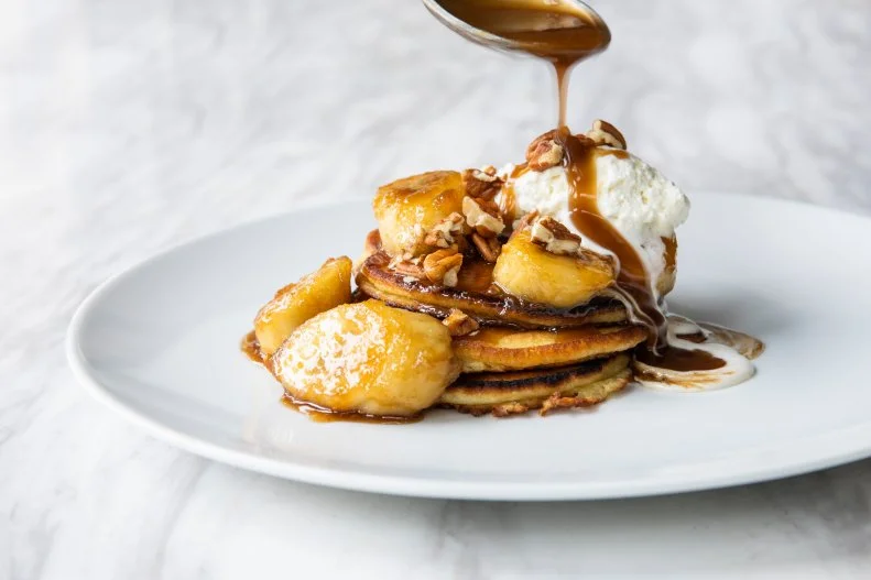 Bananas Foster prepared tableside is certainly a special-occasion ritual. But during weekend brunch at the Hay Merchant, James Beard Award-winning chef Chris Shepherd reinterprets the dessert as pancakes, complete with toasted pecans and whipped cream. Order a to-be-shared plate of them after enjoying the fried green tomato-pimento cheese BLT on Texas toast and the chicken wings with caramelized fish sauce.