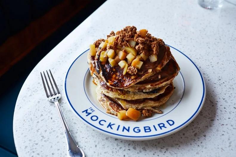 At globally influenced diner The Mockingbird, dinner revolves around specialties including bechamel chicken pot pie and bulgogi hanger steak. Brunch is just as quirky, with a slate of chorizo-egg-potato tacos and churros-style Belgian waffles, as well as pancakes billed as "syrup cushions." Blending almond granola, brown butter-glazed apples and a drizzle of miso-caramel sauce, they're a fortifying companion to the boozy Paloma popsicles.
