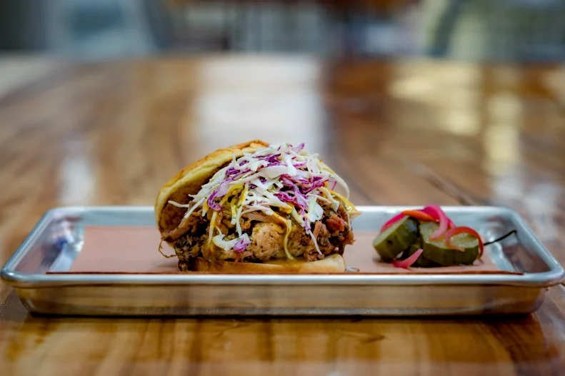 Led by couple Patrick Feges and Erin Smith, active regulars on the Houston BBQ circuit, this counter within the Greenway Plaza food court delivers the intoxicating aroma of smoked meats to the power-lunch crowd during the workweek — and only then. Between 6:30 a.m. and 3 p.m. on weekdays, breakfasters and lunchgoers can indulge in Feges' featured specialties, such as pig wings and beef belly burnt ends, or staples like ribs and brisket. The meats are accompanied by Smith's alternative takes on sides, as in the creamy, Indian-inspired yogurt-based coleslaw spiced with cumin and coriander.