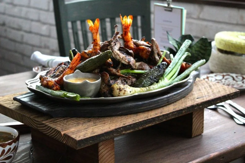 The Goode Co. name has been synonymous with great barbecue for over 40 years, and today it means even more: a slew of seafood and taqueria locations, plus a festive live-music destination, Armadillo Palace, that features a cantina next door. At the four barbecue joints, the smell of mesquite-smoked meats — slow-cooked for hours on end and carefully tended to by trusty pitmasters — still reel people in. Barbecue sandwiches are hearty, with meat piled thick on a hunk of cheesy jalapeno bread, and the Brazos Bottom Pecan Pie is iconic as far as Texas pastries go.