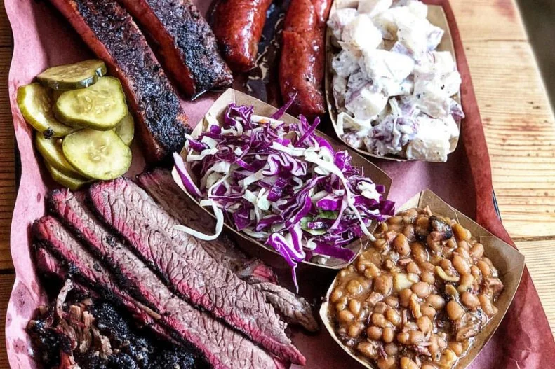 chops under the direction of Wolfgang Puck — presents his take on Texas 'cue in a no-frills structure. Fatty brisket, sausage and beef ribs are slow-smoked and incorporate a distinct flavor from being cooked over wood from vintage oak wine barrels. Sides and desserts are classic and well-executed, but here, the meat is unquestionably the main attraction.