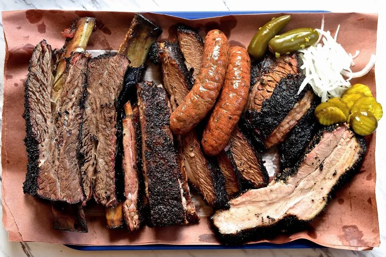 You'll find the signatures of athletes, movie stars and even politicians on the wall at this acclaimed barbecue restaurant in Pearland where Ronnie Killen also runs a burger bar, steakhouse and Mexican restaurant. There's always a crowd out front during the day, with eager diners making their way through the cafeteria-style line dig into trays piled high with meat. The pork belly burnt ends, with their crisp char and eye-catching glaze, are equal parts smoky and sweet, while the sticky, moist beef rib glistens on its bark and makes for a monstrous lunch with a couple of sides. At the end of the meal, two things are certain: Dessert should be ordered, and Killen's old-fashioned banana pudding is the way to go.