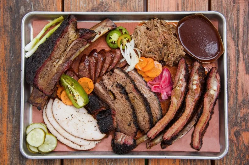 This Montrose hangout combines the two foods all Houstonians love — barbecue and tacos — and does it enormously well. In addition to beef and pork ribs, housemade Czech-style sausage and a pulled pork-smothered Frito pie generously dusted with cheddar cheese and diced raw onions, the menu boasts meaty tacos with traditional fixins like tangy salsa verde and a dollop of cool sour cream, presented in flour tortillas made with smoked brisket fat. Because … why not?