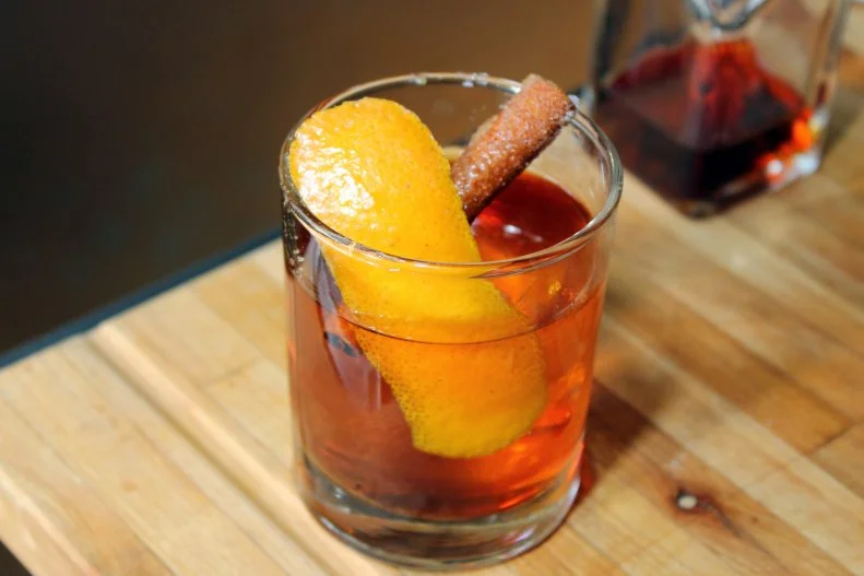 The dim sum-style cart service at the eclectic Gunshow in Atlanta extends to the cocktail program, as a drink cart is wheeled around to guests with five weekly-changing options that complement what’s currently on the chef’s menu. With bourbon, bitters, burnt sugar and brûléed cinnamon and garnished with a flamed orange peel, the Toasted Old Fashioned is always a fixture.