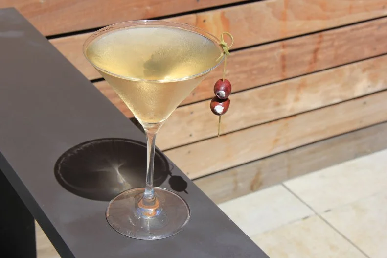 Shutters on the Beach’s bar director Josh Curtis calls this a savory option on the martini spectrum that lets bartenders interact with guests and share a little drink history. Absolut Elyx Vodka is stirred with Dirty Sue Premium Olive Juice and housemade banana peel bitters; it’s strained into a glass misted with Tio Pepe Sherry and garnished with a feta-stuffed kalamata olive.