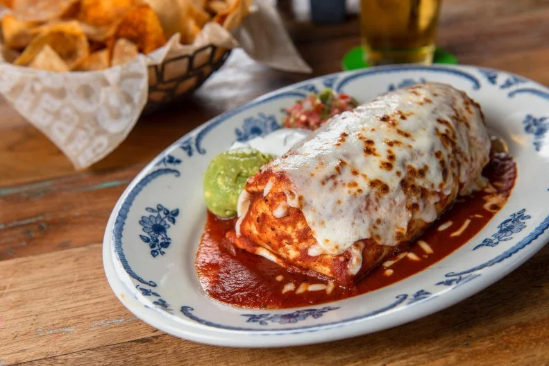 Rocco's Tacos & Tequila Bar has several locations scattered throughout the United States, but hungry Brooklynites will be the first to say that the Brooklyn location is a safe bet for when burrito cravings hit hard. A fan favorite, the Wet Burrito Con Rojo is stuffed with flavorful chicken, beef or pork, along with black beans, Cotija cheese, fragrant yellow rice, cilantro and salsa rojo.