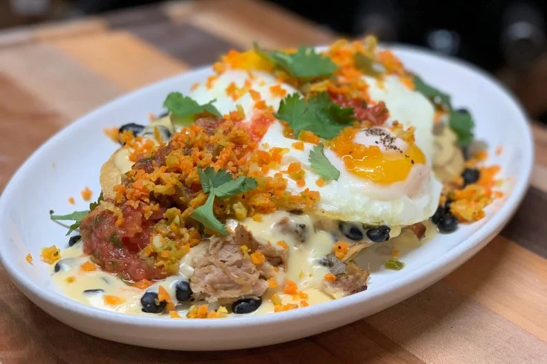 When burrito hunger strikes in Charleston, Home Team BBQ is the cure. For brunch (served at the Sullivan's Island and downtown Charleston locations only), it's all about the meat-centric breakfast burrito stuffed to the brim with scrambled eggs, chorizo, carnitas, black beans, tots, salsa verde, salsa roja, queso and pork cracklings. For lunch or dinner (all locations), the BBQ and burrito worlds collide with the famed BBQ burrito. It comes with all the deliciousness of both items: pulled pork or chicken, mashed potatoes, slaw, creamed corn, red BBQ and a flour tortilla. Serious barbecue fanatics can upgrade to brisket for a buck extra.