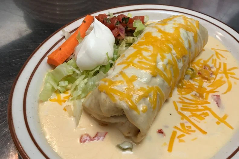 At Jacky's Restaurant in Sioux Falls, the Wet Burrito will satisfy your hunger within one bite. It's a giant flour tortilla chock-full of rice, beans and the protein of your choice (we strongly suggest al pastor or chorizo) that's appropriately drenched in green or red sauce and melted cheese and then garnished with lettuce, tomatoes and sour cream.