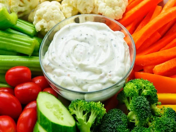 Platter of assorted fresh vegetables with dip