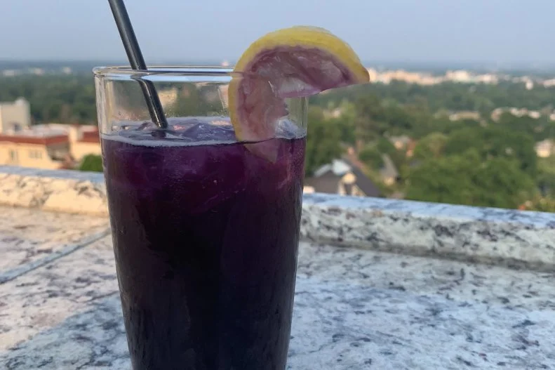 Many cocktails have a story behind them, but few can rival the chilling tale behind The Emily, a gin number served at The P.I. Bar & Grill at The Partridge Inn in Augusta. The hotel has been part of the town’s history for more than a century, and one of its most famous guests, Emily, has been around just as long. Legend has it that on her wedding day, Emily was getting dressed in the bridal suite at The Partridge Inn, when she received news that her fiancé had been shot in a case of mistaken identity while riding his horse through town. Emily was so grief-stricken that she refused to take her wedding dress off for weeks. And though she was pursued by many suitors, she never wed — some say she eventually died of a broken heart. To this day, hotel guests and employees have reported seeing a beautiful girl with long, dark hair wandering the halls and staircases, and she is often spotted in The P.I. Bar & Grill in her wedding dress awaiting her groom’s arrival. Toast Emily with her namesake cocktail, which gets its signature purple hue from a mix of butterfly pea flower tea and blueberry-and-lavender simple syrup.