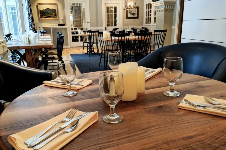 For over two centuries, Norwich Inn has been a dining and lodging destination, dating back to its original owner, Colonel Jasper Murdock. Famous people who spent time at the Inn include fellow Dartmouth student Theodore Seuss Geisel (aka Dr. Seuss), but the one with the most-spirited reputation is Ma Walker. Walker owned the Inn in the 1920s and purportedly maintained the Inn’s tavern tradition during Prohibition by selling bootleg from the basement. Guests and diners alike have heard or seen Walker coming down the main staircase, and one gentleman, sleeping alone, felt firm, gentle hands shaking him awake. Whether you need to revive your own spirit after a spooky night at the Inn or refuel after a day on the Connecticut River or hiking the Appalachian Trail, stop by Jasper Murdock’s Alehouse, the Inn’s on-site brew-pub. Try the Cabot cheddar-topped burger or the Whistling Pig Red Ale beer-battered fish and chips, and wash it down with craft suds like a Seussian-inspired IPA called Hops on Top. For a more formal dining experience, book a table in the Terrace which boasts a fireplace, plenty of windows and historic charm in spades.