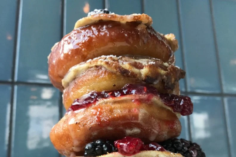 This Inman Park eatery had us at "doughnuts." Every weekend throngs make their way to the basement-level spot for creative fried dough and other brunch dishes. You can make your own doughnut sampler of flavors like The Irishman (spiked with Irish cream, espresso and a whiskey glaze), Buford Highway (dipped in salted caramel and sprinkled with pork cotton candy) and El Churro (sprinkled with cinnamon sugar and served with honey butter dipping sauce) before moving on to more savory pursuits like hominy hash and a particularly memorable cheeseburger. With this kitschy spot, restaurateur Ford Fry has created a 1970s throwback — complete with shag-carpet wall hangings and wood paneling — that feels completely of the moment.