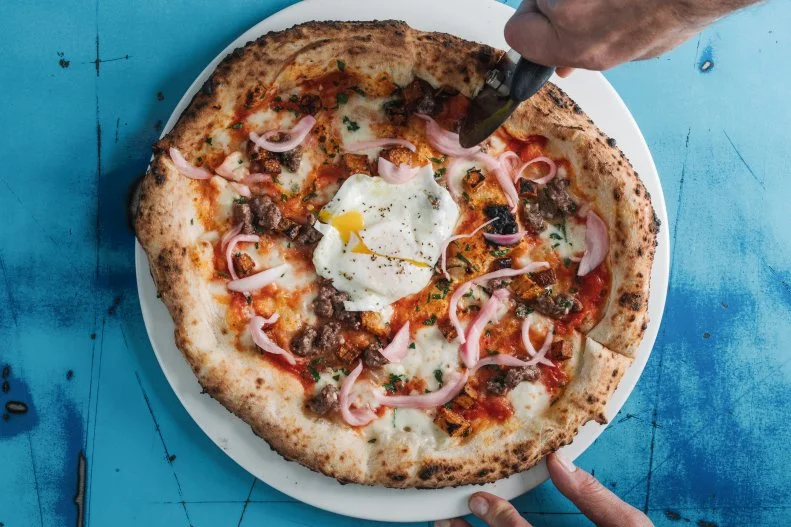 "Throw an egg on it" is a worthy brunch strategy and one that this Neapolitan pizza joint near Piedmont Park has adopted wholeheartedly. While it has only four brunch pies, pizza lovers are sure to find something to strike their fancy. The Colazione Americana comes with roasted cremini mushrooms, spicy Italian sausage, mozzarella, pancetta and crumbled egg yolk, and guests can opt to have the Occhio di Bue's fresh mozzarella, San Marzano tomatoes, truffled potatoes and beef topped with a fried egg. The communal tables, fresh cannoli, rich espressos and Italian wine offerings are primed to make every meal a party.
