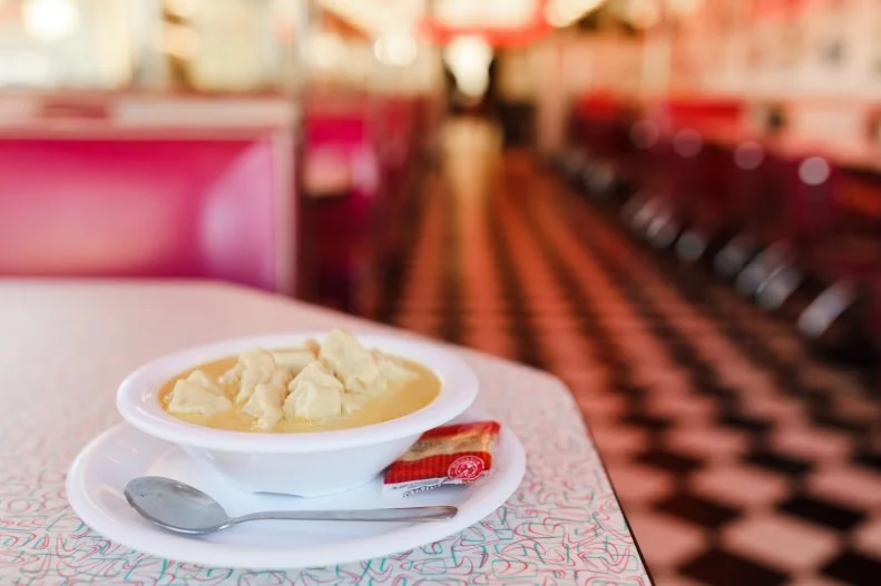 Jim and Alvina Glatt founded Kroll's Diner in Bismarck in 1969, and though there are now five locations across the Roughrider State, it has remained a family-owned business. Each location maintains a '60s-throwback vibe, with checkered floors, neon accents and a jukebox cranking out tunes. You can't go wrong with classic diner combos like steak and eggs or a burger and a shake, but don't miss the German specialties for which the diner is known. You'll find staples such as fleischkuechle (meat pies) and kuchen (stuffed and deep-fried savory pastries), but the hands-down favorite is Knoephla Soup, a creamy broth-based soup with potato dumplings bobbing in it. It might not be the prettiest dish (at the diner it's fondly referred to as Lumpy Yellow Soup), but there's no denying the warmth and comfort a bowl brings, especially during North Dakota's notoriously harsh winters, when the Fargo location alone goes through 245 gallons of this soup a month. And even if you think you don't have a sweet tooth, the underrated rhubarb caramel roll, made with local wild rhubarb, is a must-try; it strikes the right balance between sweet and tart.