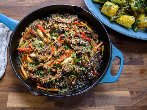 https://food.fnr.sndimg.com/content/dam/images/food/fullset/2019/11/08/TM2901_crazy-Szechuan-beef-and-messy-corn-with-shishito-peppers_s4x3.jpg.rend.hgtvcom.616.462.suffix/1573237447983.jpeg