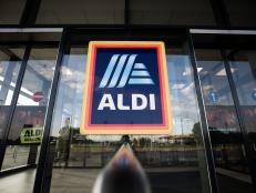 A sign hangs at the entrance to an Aldi Stores Ltd. grocery store in Ullo, Hungary, on Monday, July 8, 2019. Aldi, known for its spartan approach to retailing, plans to make all of its private-label packaging reusable, recyclable or compostable by 2025, while cutting packing materials for those products by 15 percent over the same period. Photographer: Akos Stiller/Bloomberg via Getty Images