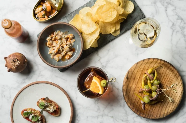 Cúrate is often credited with placing Asheville on America’s dining map. Stepping into acclaimed chef Katie Button’s restaurant — with its vermouth bar and charcuterie station — is like stepping into a family restaurant in a small Spanish town. Button and husband Felix Meana — with mentoring from the likes of José Andrés and Ferran Adrià — serve cochinillo (roasted suckling pig), traditional paellas and a killer selection of papa el aperitivo (snacks) like latas (premium Spanish tin seafood), montaditos (small bites on toast points) and gilda (anchovy, olive and piparra pinchos). 