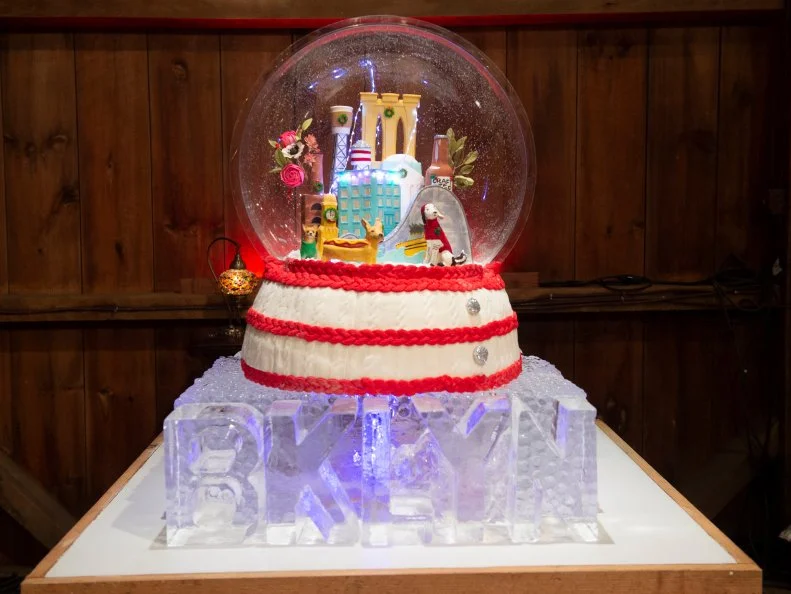 Competitors Kate Sullivan and Sara Porter's Snow Globe display, as seen on Santa's Baking Blizzard, Season 1.