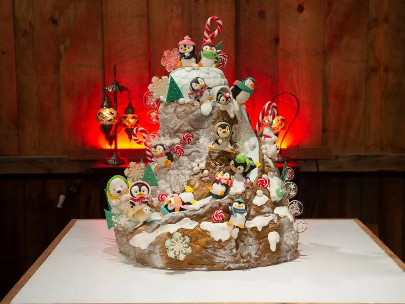 Competitors Vivian Pham and Sachiko Windbiel's Snowed In inspired cake, as seen on Santa's Baking Blizzard, Season 1.