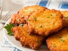 Homemade Traditional Potato Pancake Latke on a Background