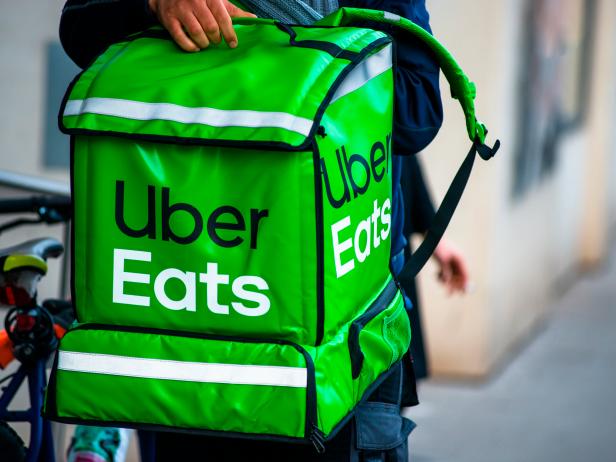 Uber Eats is an American online food ordering and delivery service. Delivery in progress on Vienna street. Austria. (Photo by: Education Images/Universal Images Group via Getty Images)
