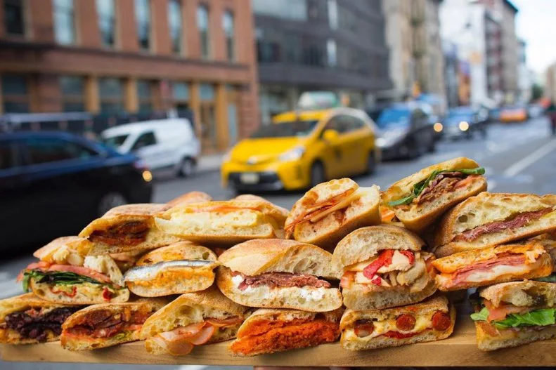 A typical Spanish bocadillo is a simple affair. (The word translates as "snack," which is what it's considered, not a full meal.) Crusty Spanish bread is moistened with a sliced tomato and topped with a thin layer of fillings like jamón ibérico, Manchego cheese and chorizo. Despaña in NYC offers a wide selection of bocadillo fillings — including vegan and vegetarian options — but the traditional chorizo is its top seller. U.S. pork is combined with pimentón de la vera (sourced from Spain) in a natural skin casing, cut into slices and grilled, then layered with sliced Manchego cheese and drizzle of Spanish extra-virgin olive oil on a rustic baguette. The flavorful mix is pressed in a sandwich grill to melt the cheese and toast the bread.