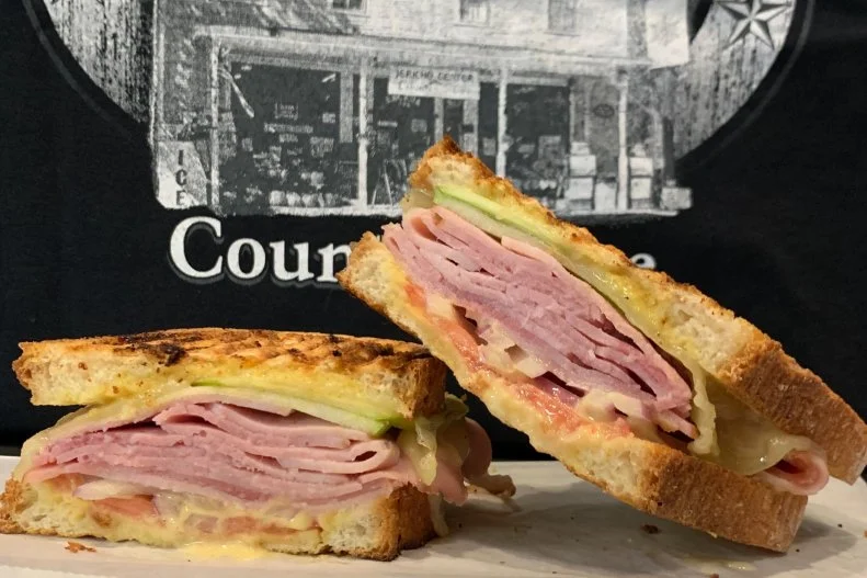 Vermont, home to some of the most-beloved ice cream in the U.S. — yes, Ben & Jerry’s — also has its own sandwich. The Vermonter features either turkey or ham, layered with local sharp cheddar (of course), slices of crisp green apples and honey mustard. It’s available all over the state, but the Vermonter Panini at Jericho Country Store is worthy of its own trip. It features Boar’s Head sweet ham, Cabot cheddar, slices of Granny Smith, red onion, tomato and honey mustard squished between two slices of sourdough bread. Once it’s assembled, the crew here toast it in the panini grill, making it hit all the flavor notes and textures.