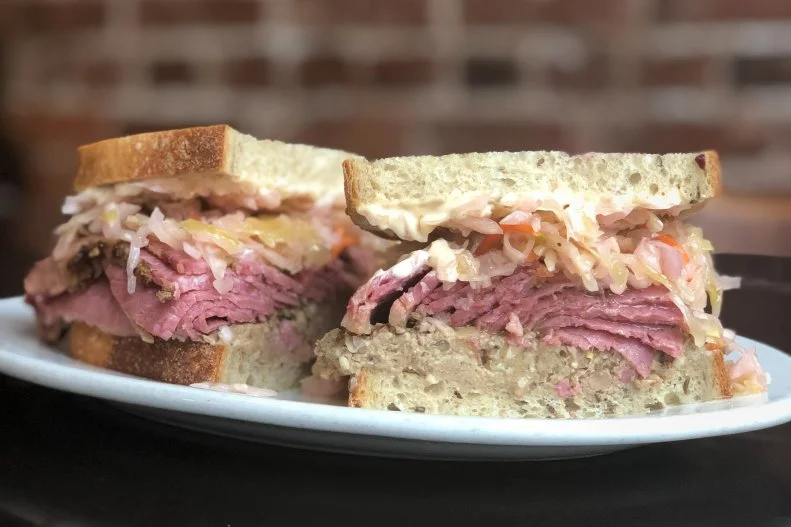 Having to ask “What am I, chopped liver?” is generally not considered a good thing. Traditionally, chopped liver was served as a side dish, not a main course, so the phrase is associated with feeling overlooked. But that delicious Jewish-style pate is a star in the eyes of many sandwich lovers. The filling, a mix of cooked, trimmed liver, hand-chopped with onions in a sort of rough pate, is incredibly flavorful, and many consider it a delicacy. It’s even better layered with house-smoked pastrami, coleslaw and Russian dressing at Kenny & Zuke’s. Known as Ken’s Special, this amped-up chopped liver sandwich comes on fresh rye bread made from scratch daily at the new-school Portland deli.
