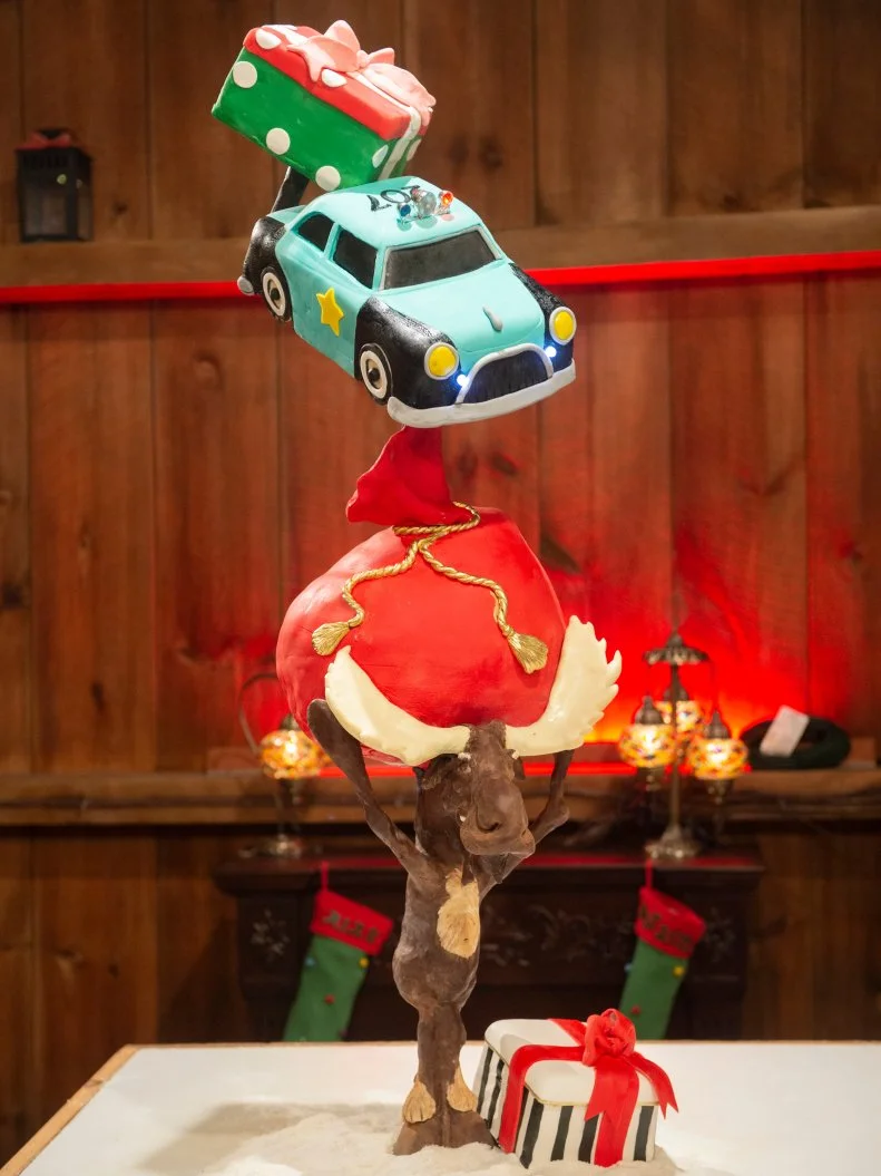 Competitors Mike Elder and Jon Heuys' topsy-turvy cake, as seen on Santa's Baking Blizzard, Season 1.