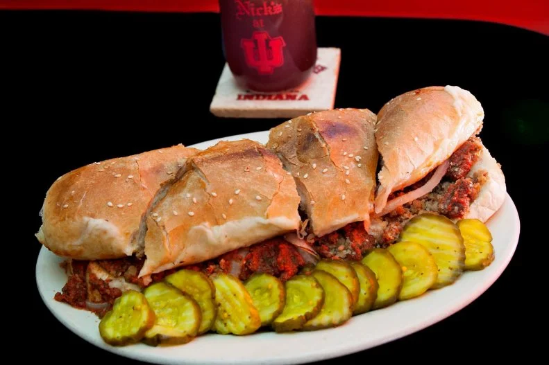 A Bloomington tradition since 1927, Nick's is the place to be during Indiana University games. And what better way to support the hometown Hoosiers than by fortifying oneself with "Kick-Offs and Sidelines" like battered mushrooms, nacho cheese-smothered breadsticks and garlic mayo-dunked fries, followed by pork tenderloin sandwiches, strombolis and subs, and burgers made from Black Angus premium beef sourced from a nearby, 100-year-old farm.