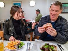 Hosts Sophie Flay and Bobby Flay sample the Lobster Rolls and French Fries at Ed's Lobster Bar, as seen on Flay vs Flay, Season 1.