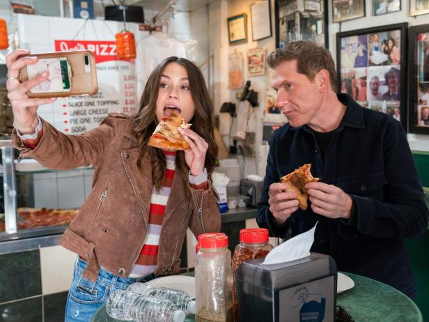 Hosts Sophie Flay and Bobby Flay sample the Pizza at Joe's Pizza in New York, as seen on Flay vs Flay, Season 1.